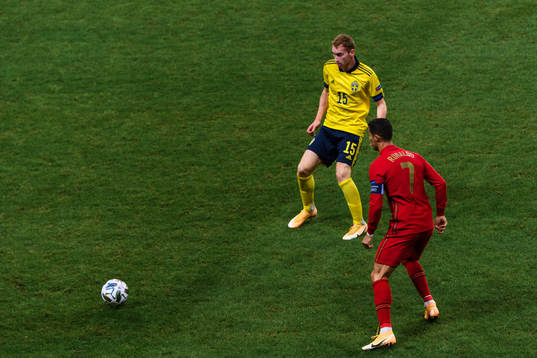 Dejan Kulusevski of Sweden and Cristiano Ronaldo of Portugal
