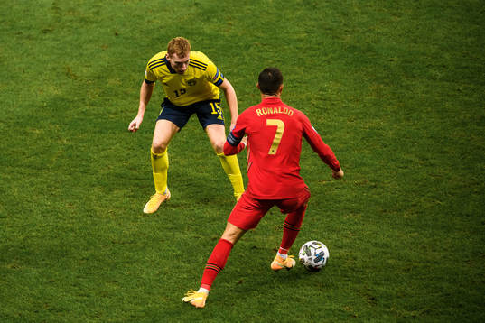 Dejan Kulusevski of Sweden and Cristiano Ronaldo of Portugal