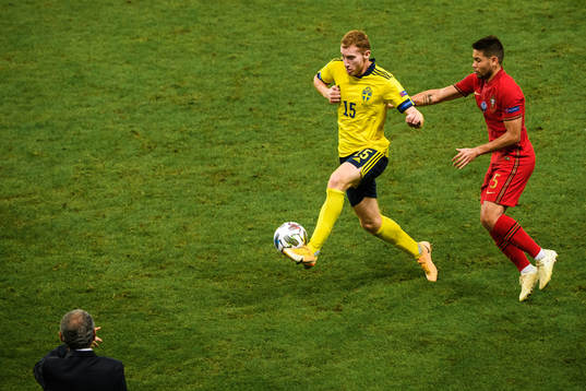 Dejan Kulusevski of Sweden and Raphael Guerreiro of Portugal