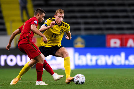 Raphael Guerreiro of Portugal and Dejan Kulusevski of Sweden