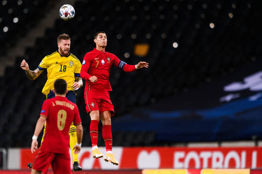 Pontus Jansson of Sweden and Cristiano Ronaldo of Portugal