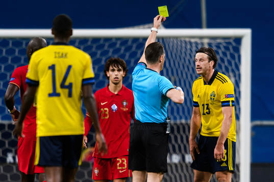 Gustav Svensson of Sweden receives his second yellow card