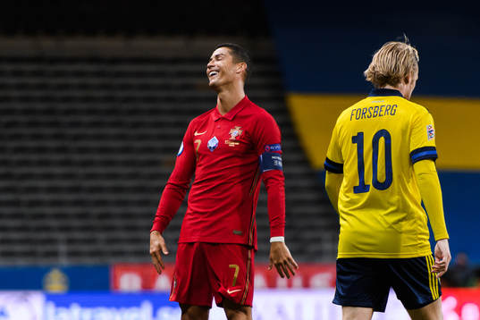 Cristiano Ronaldo of Portugal and Emil Forsberg of Sweden