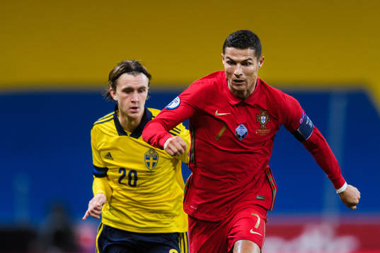 Kristoffer Olsson of Sweden and Cristiano Ronaldo of