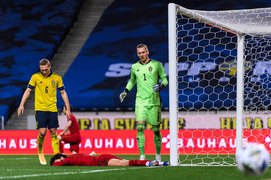 Ludwig Augustinsson and goalkeeper Robin Olsen of Sweden