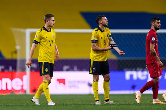 Mattias Svanberg and Marcus Berg of Sweden look dejected