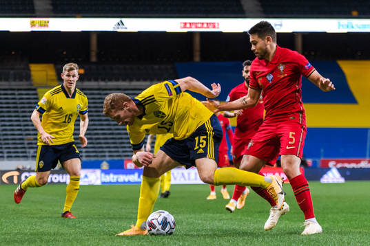 Dejan Kulusevski of Sweden and Raphael Guerreiro of Portugal