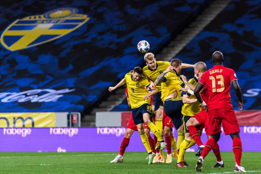 Marcus Berg and Filip Helander of Sweden