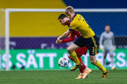 Filip Helander of Sweden and Cristiano Ronaldo of Portugal