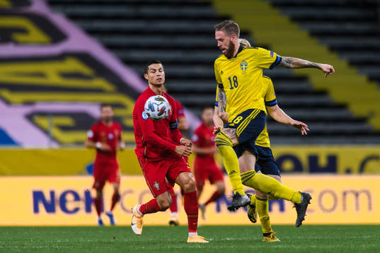 Cristiano Ronaldo of Portugal and Pontus Jansson of Sweden