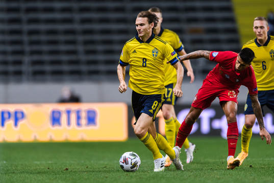 Albin Ekdal of Sweden and Joao Cancelo of Portugal