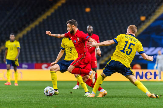Bruno Fernandes of Portugal and Dejan Kulusevski of Sweden