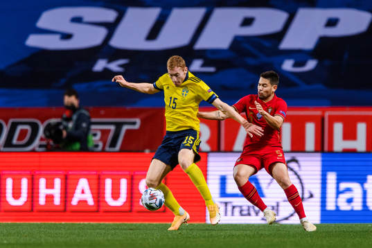 Dejan Kulusevski of Sweden and Raphael Guerreiro of Portugal