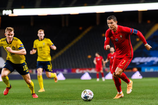 Emil Krafth of Sweden and Cristiano Ronaldo of Portugal