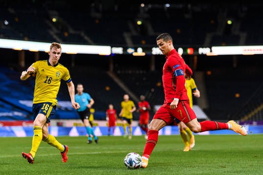 Emil Krafth of Sweden and Cristiano Ronaldo of Portugal