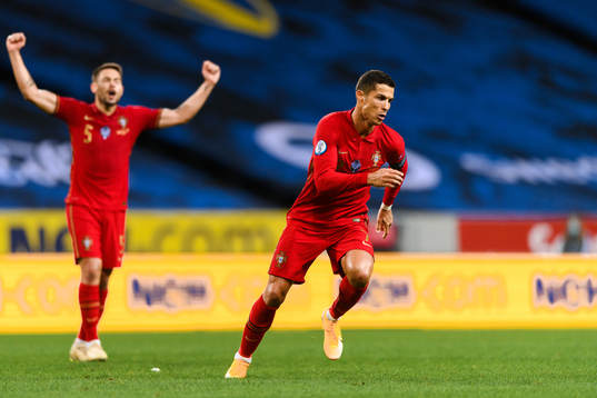 Raphael Guerreiro and Cristiano Ronaldo of Portugal