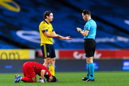 Gustav Svensson of Sweden receives his second yellow card