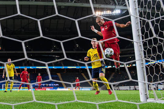 Emil Krafth of Sweden sees Pepe of Portugal miss a scoring