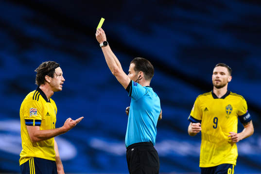 Gustav Svensson of Sweden receives his second yellow card