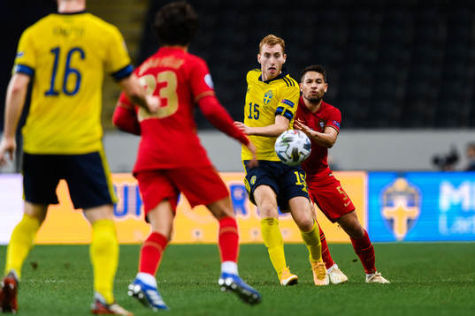 Dejan Kulusevski of Sweden and Raphael Guerreiro of Portugal