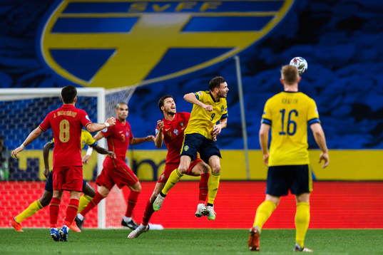 Ruben Dias of Portugal and Marcus Berg of Sweden