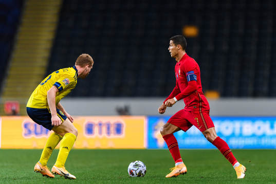 Dejan Kulusevski of Sweden and Cristiano Ronaldo of Portugal