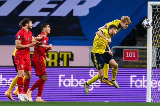 Marcus Berg and Filip Helander of Sweden against Ruben Dias