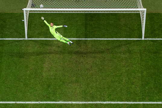 Goalkeeper Robin Olsen of Sweden lets in the 0-1 goal from