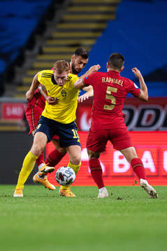 Bruno Fernandes and Raphael Guerreiro of Portugal are being