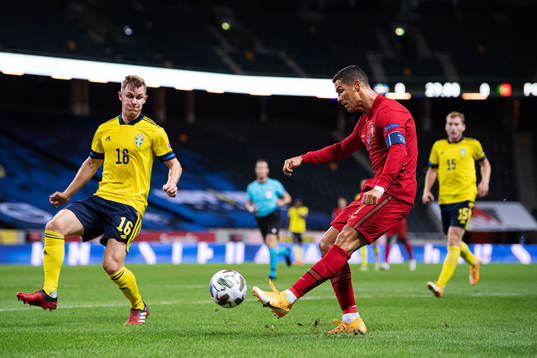 Emil Krafth of Sweden and Cristiano Ronaldo of Portugal