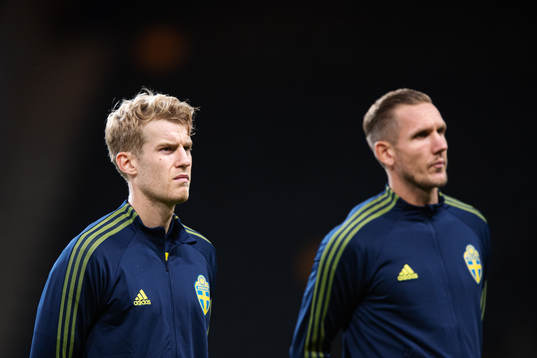 Filip Helander and goalkeeper Robin Olsen of Sweden