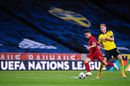 Raphael Guerreiro of Portugal and Dejan Kulusevski of Sweden
