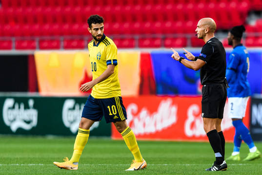 Daleho Irandust of Sweden and Referee Luis Godinho