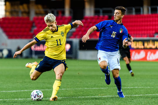 Pontus Almqvist of Sweden scores the 2-0 goal infront of