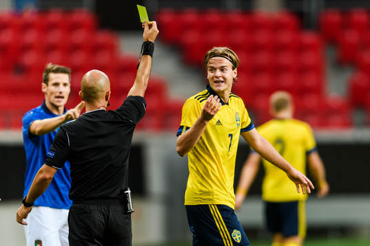 August Erlingmark of Sweden receives a yellow card