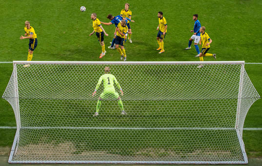 Thomas Poppler Isherwood of Sweden clears the ball in front