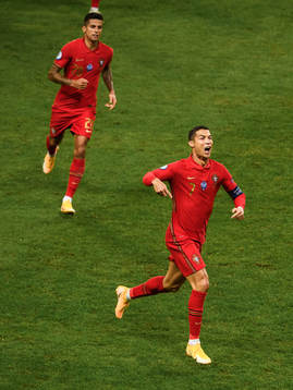 Joao Cancelo and Cristiano Ronaldo of Portugal celebrate