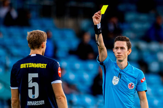 Niklas Gunnarsson of Strømsgodset receives a yellow card