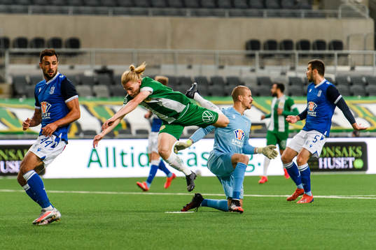 Gustav Ludwigson of Hammarby and goalkeeper Filip Bednarek