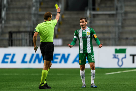 Jeppe Andersen of Hammarby receives a yellow card from