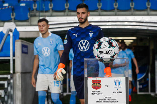 Goalkeeper Marko Johansson of Malmö FF and the official