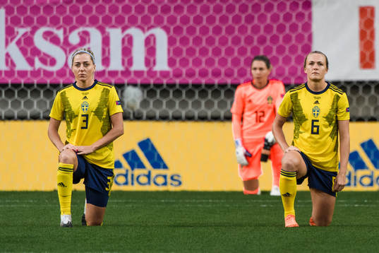 Linda Sembrant and Magdalena Eriksson of Sweden kneels in