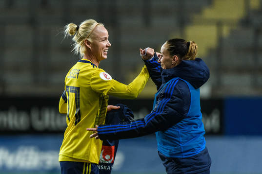 Caroline Seger and Kosovare Asllani of Sweden celebrate