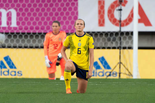 Magdalena Eriksson of Sweden kneels in support of the