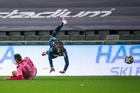 Olmo González Casado of Europa FC and Edward Chilufya of