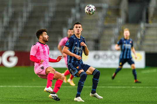 Ethan Jolley of Europa FC and Haris Radetinac of