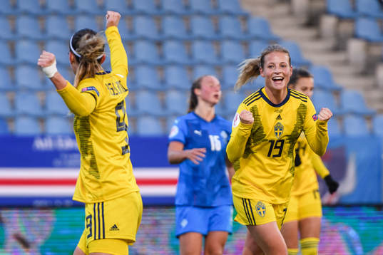 Kosovare Asllani and Anna Anvegård of Sweden celebrate the