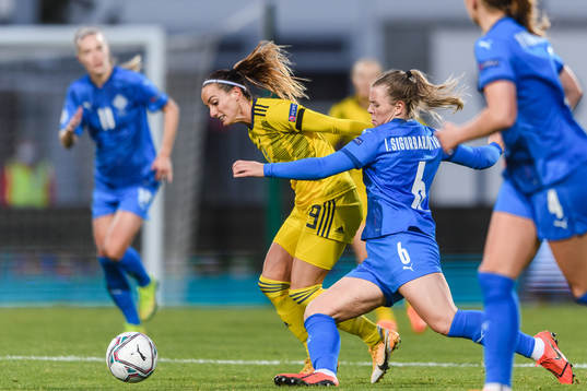 Kosovare Asllani of Sweden and Glodis Perla Viggosdottir of