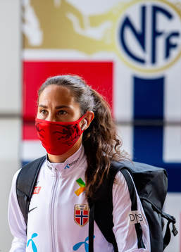 Ingrid Moe Wold of Norway arrives wearing a face mask