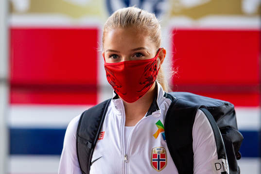 Goalkeeper Guro Pettersen of Norway arrives wearing a face